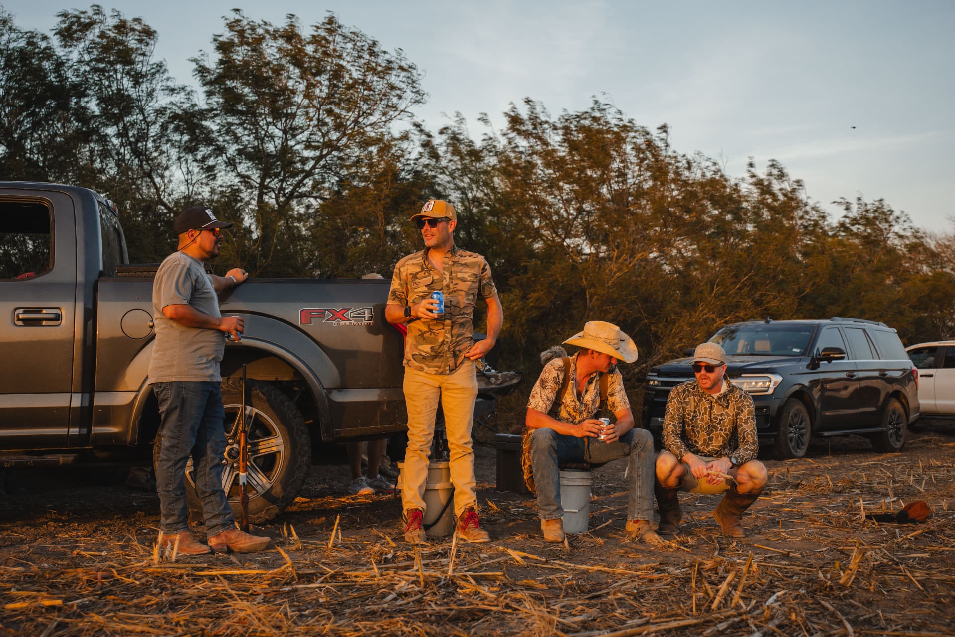 Hunters unwinding at the tailgate after the shoot