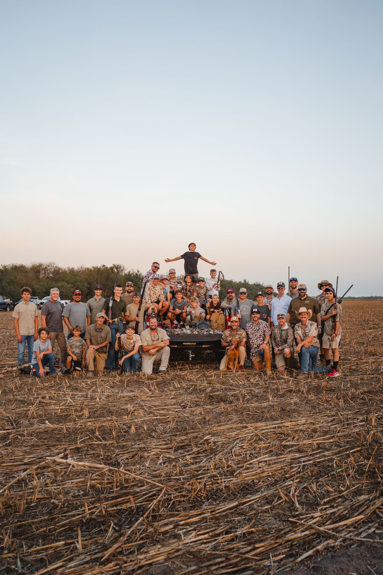 The whole crew and the dog posed around the day's doves