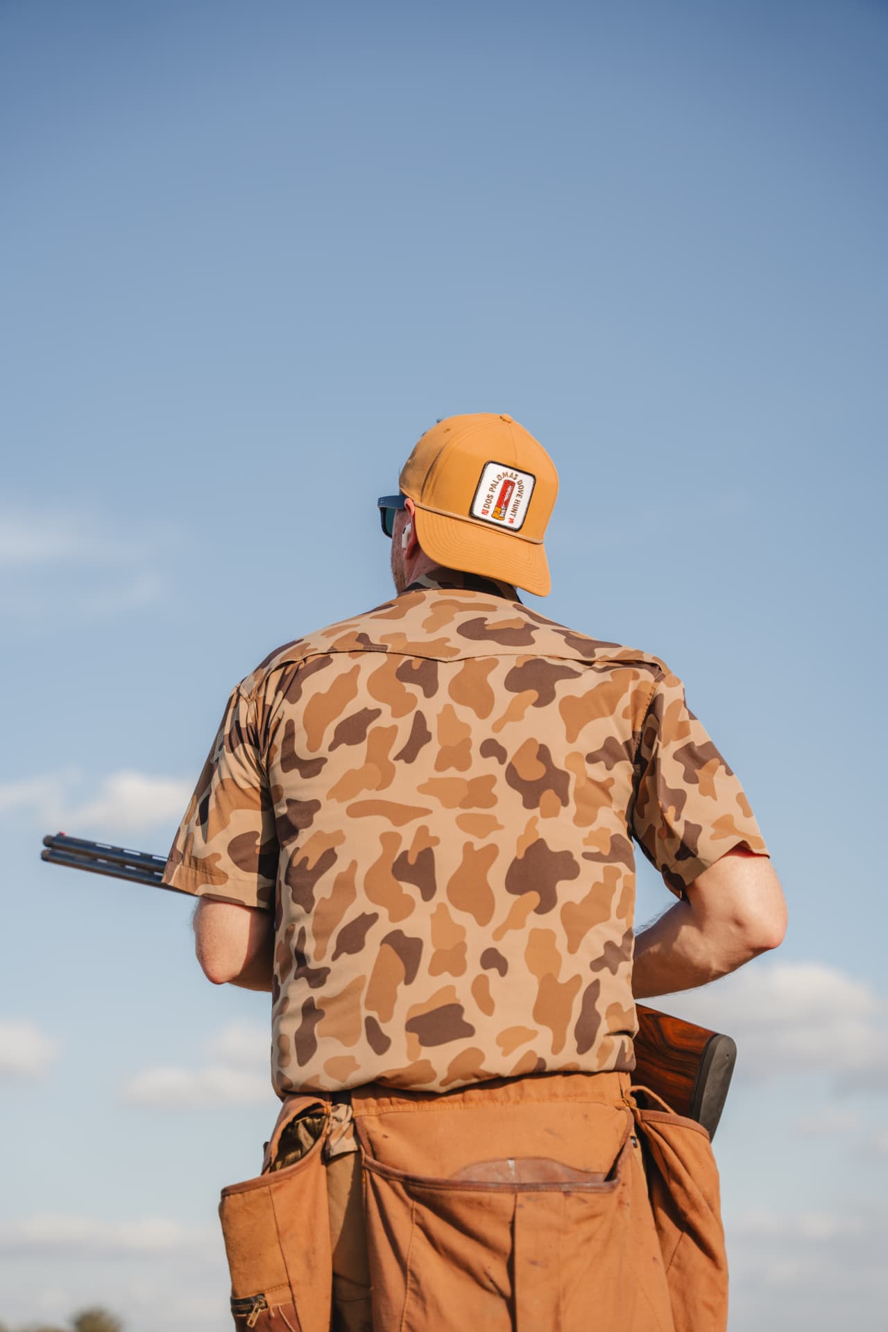 Hunter in vintage camo scanning the horizon for doves