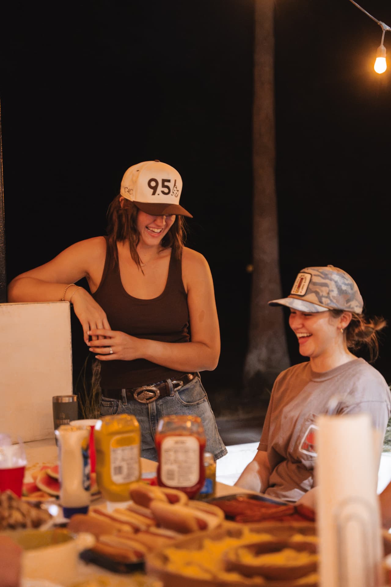Laughter at the supper table loaded with hot dogs