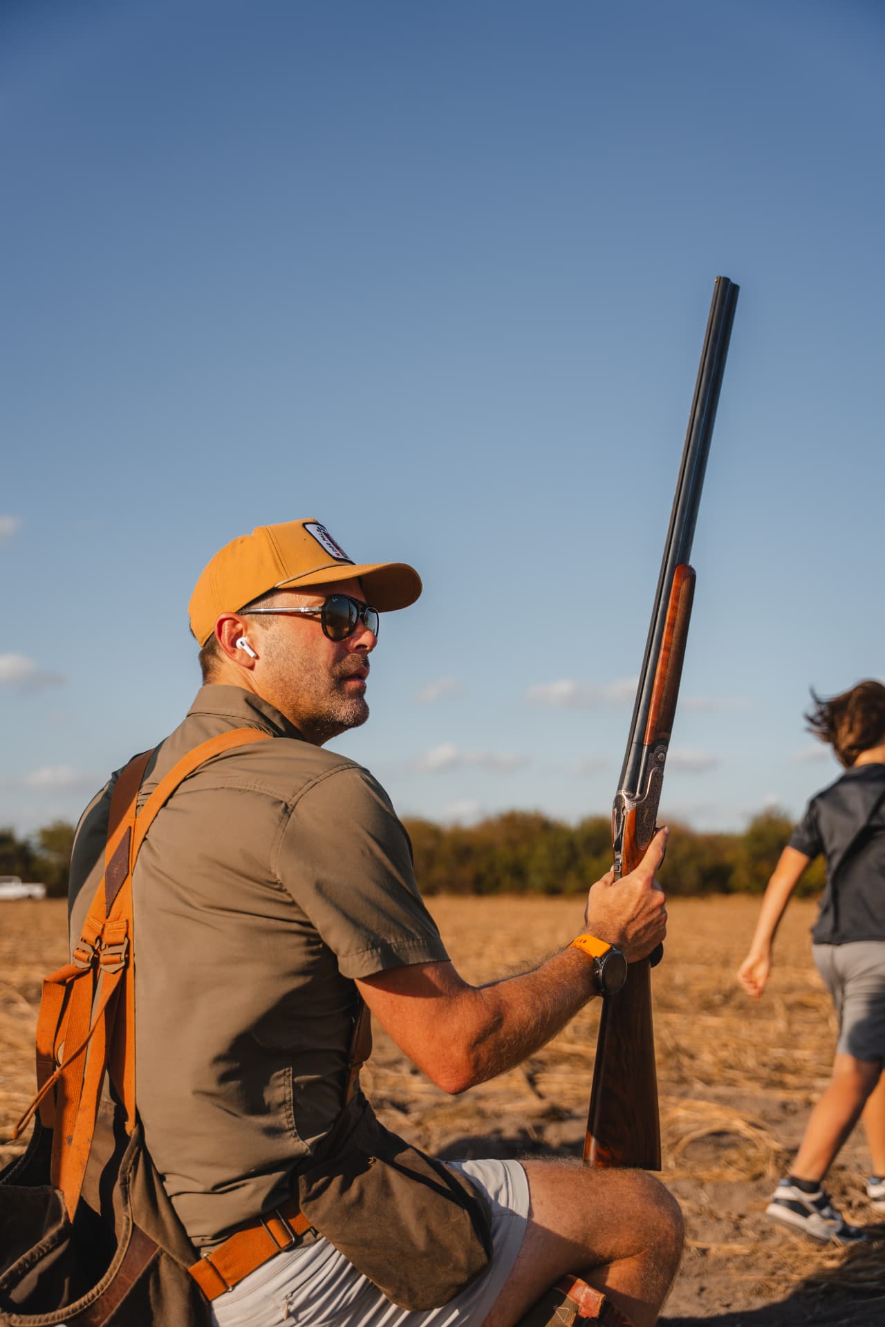Hunter resting in the field, watching the sky for doves