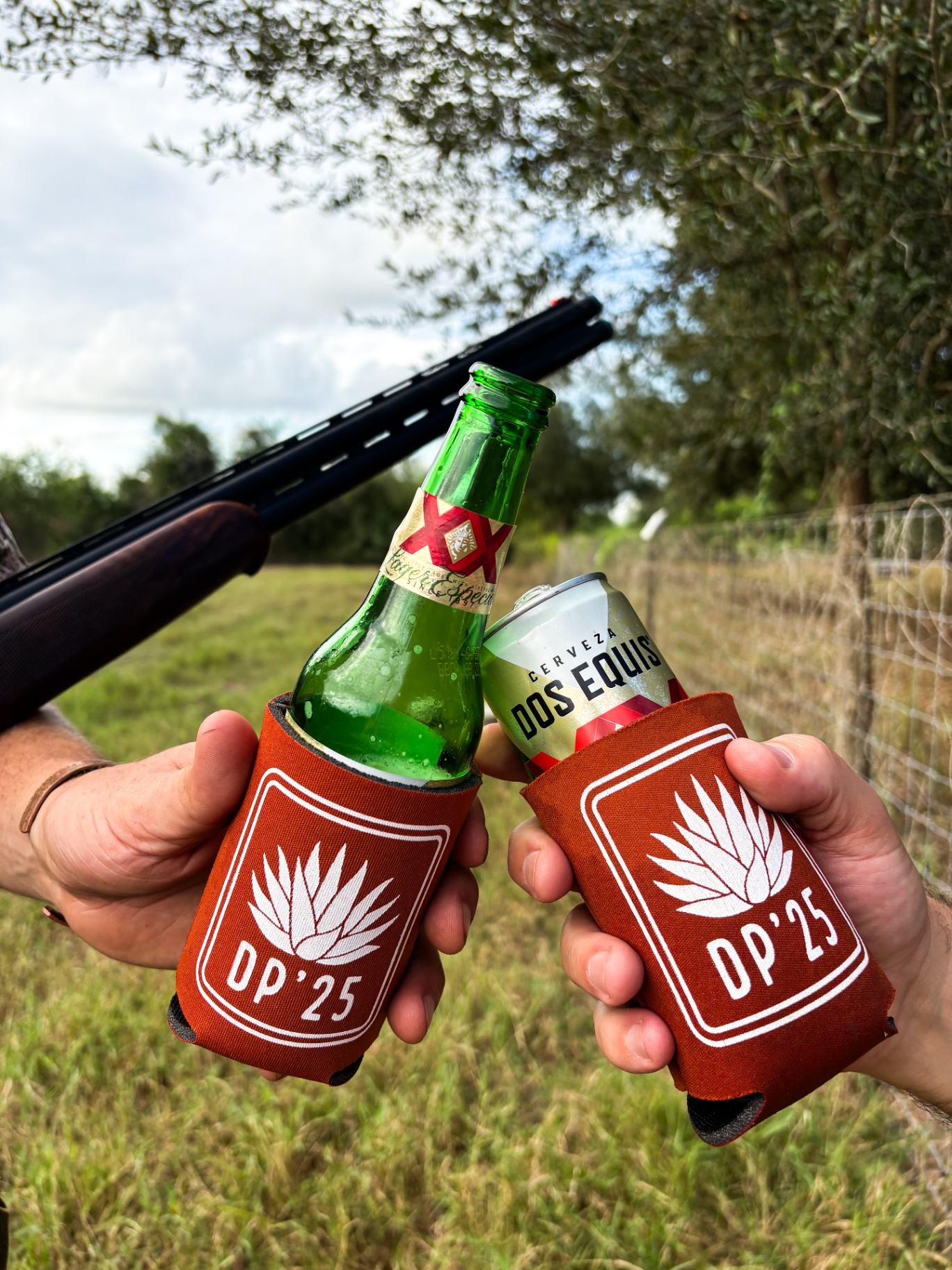Cheers with DP'25 koozies in the field