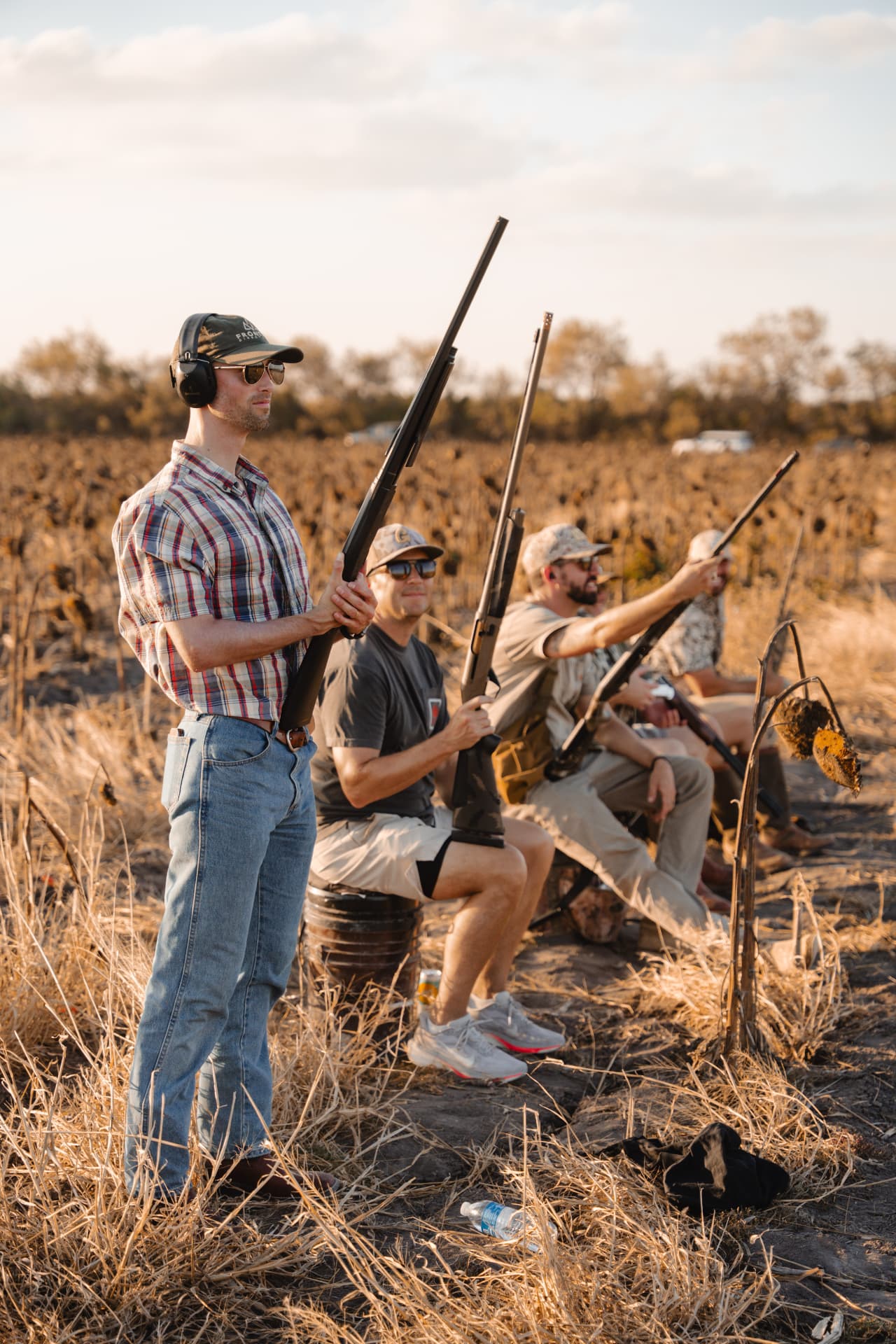Hunters waiting along the field edge for incoming birds
