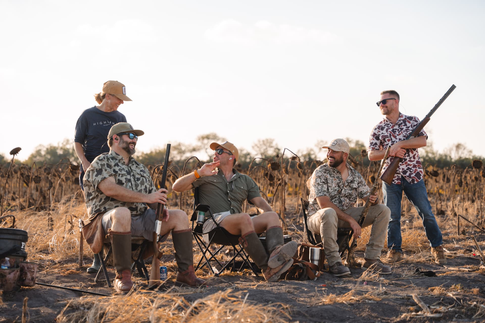 Camp chairs and laughs between flights at the field's edge