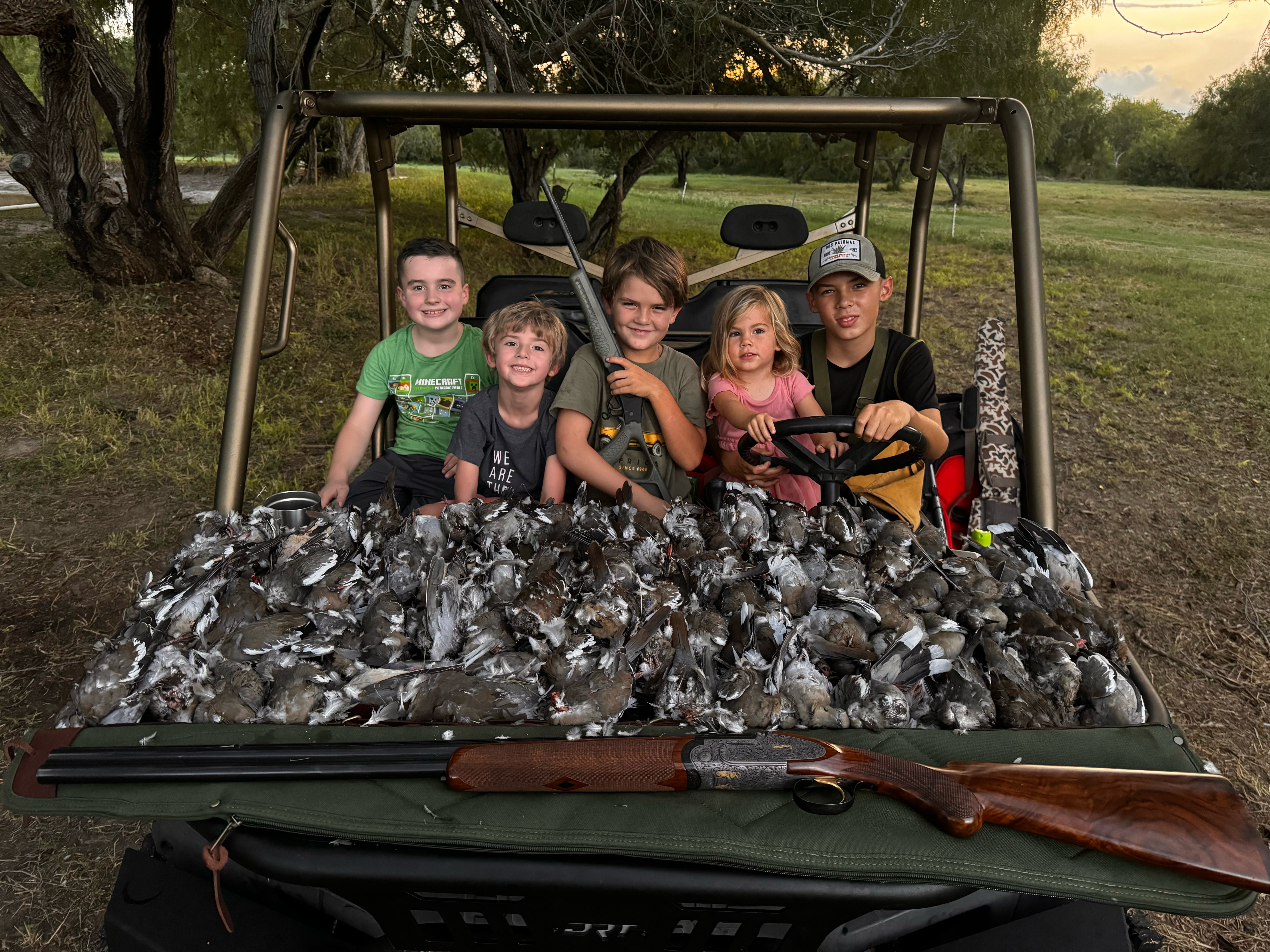 Pond view with hunters and waterfowl