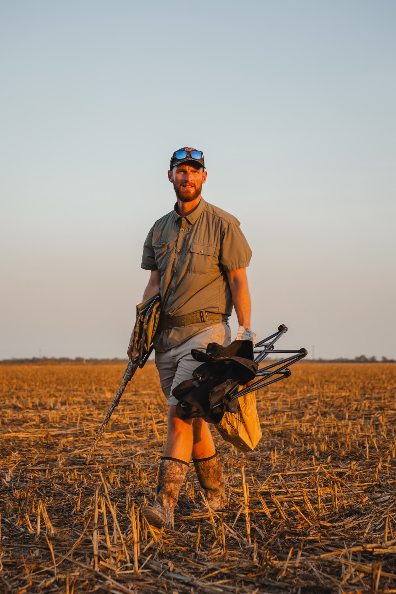 Carrying guns, gear and blind chairs across the field